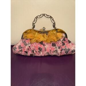 Vintage floral evening clutch with a metal frame and handle From The 90’s